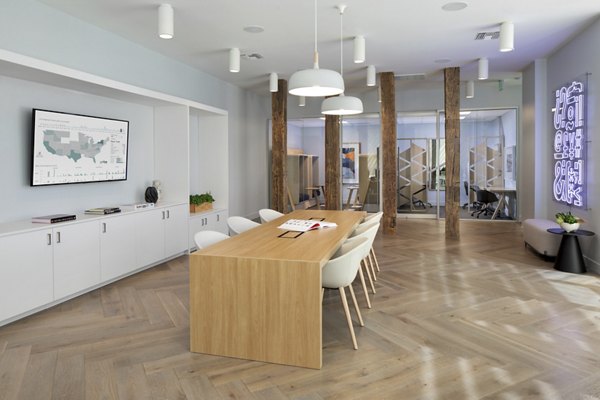 Clubhouse with modern seating and entertainment space at Lynhaven Apartments, a Greystar luxury complex