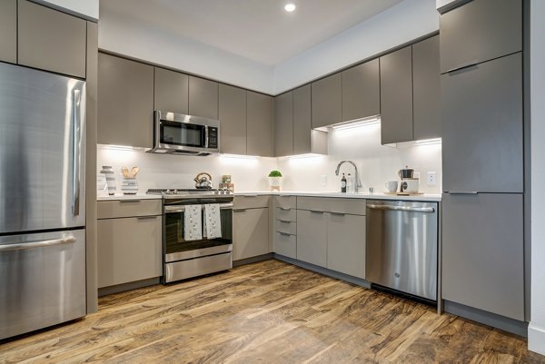 Contemporary kitchen with modern appliances at Lynhaven Apartments