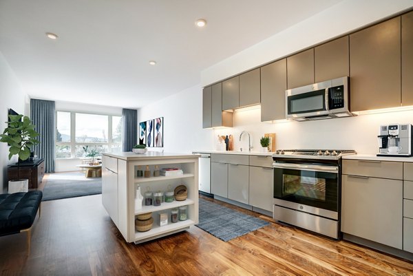 Modern kitchen with sleek cabinetry and stainless steel appliances at Lynhaven Apartments luxury residences