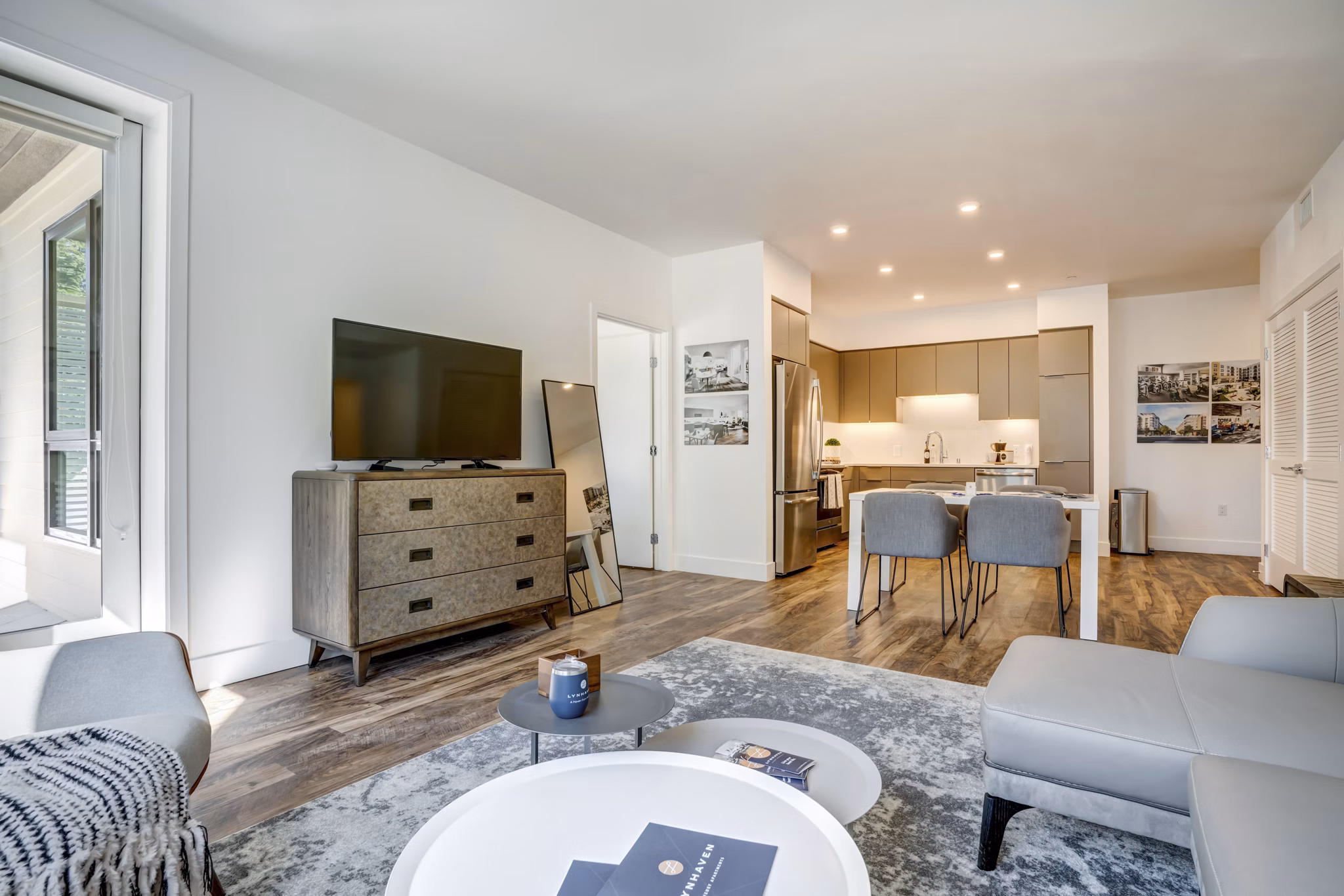 Spacious living room with modern decor at Lynhaven Apartments, featuring elegant furnishings and natural light