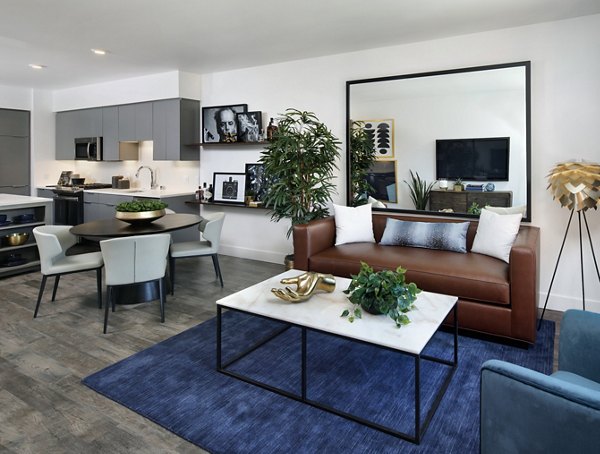 Modern living room with stylish furnishings and large windows at Lynhaven Apartments