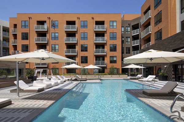 Resort-style pool with lounge chairs at Lynhaven Apartments offering luxury living experiences