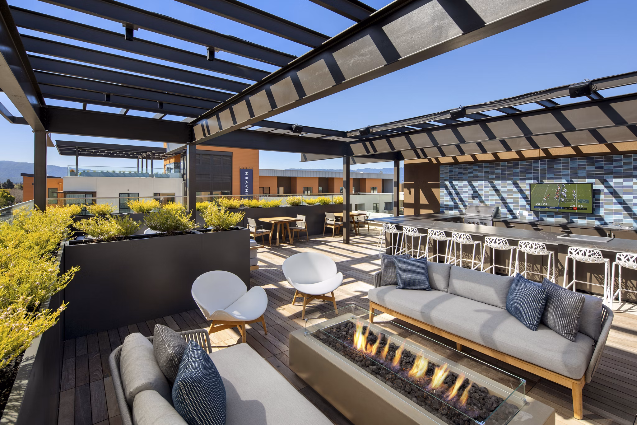 Cozy fire pit area with outdoor seating at Lynhaven Apartments, a Greystar luxury apartment community