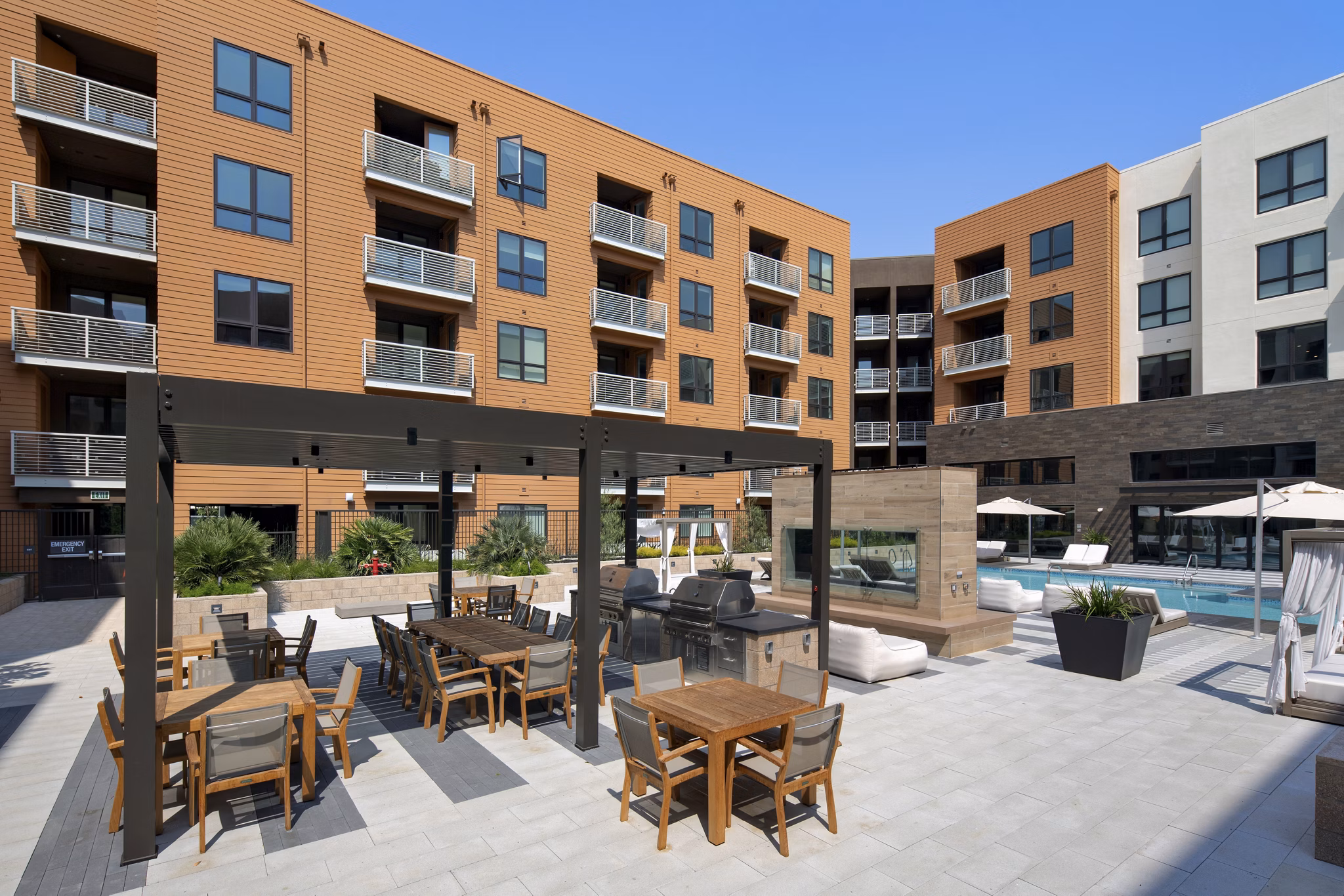 Courtyard featuring lush gardens and seating areas at Lynhaven Apartments