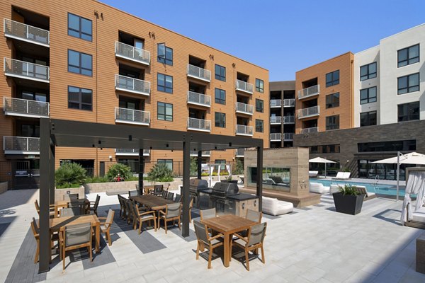 Courtyard featuring lush gardens and seating areas at Lynhaven Apartments