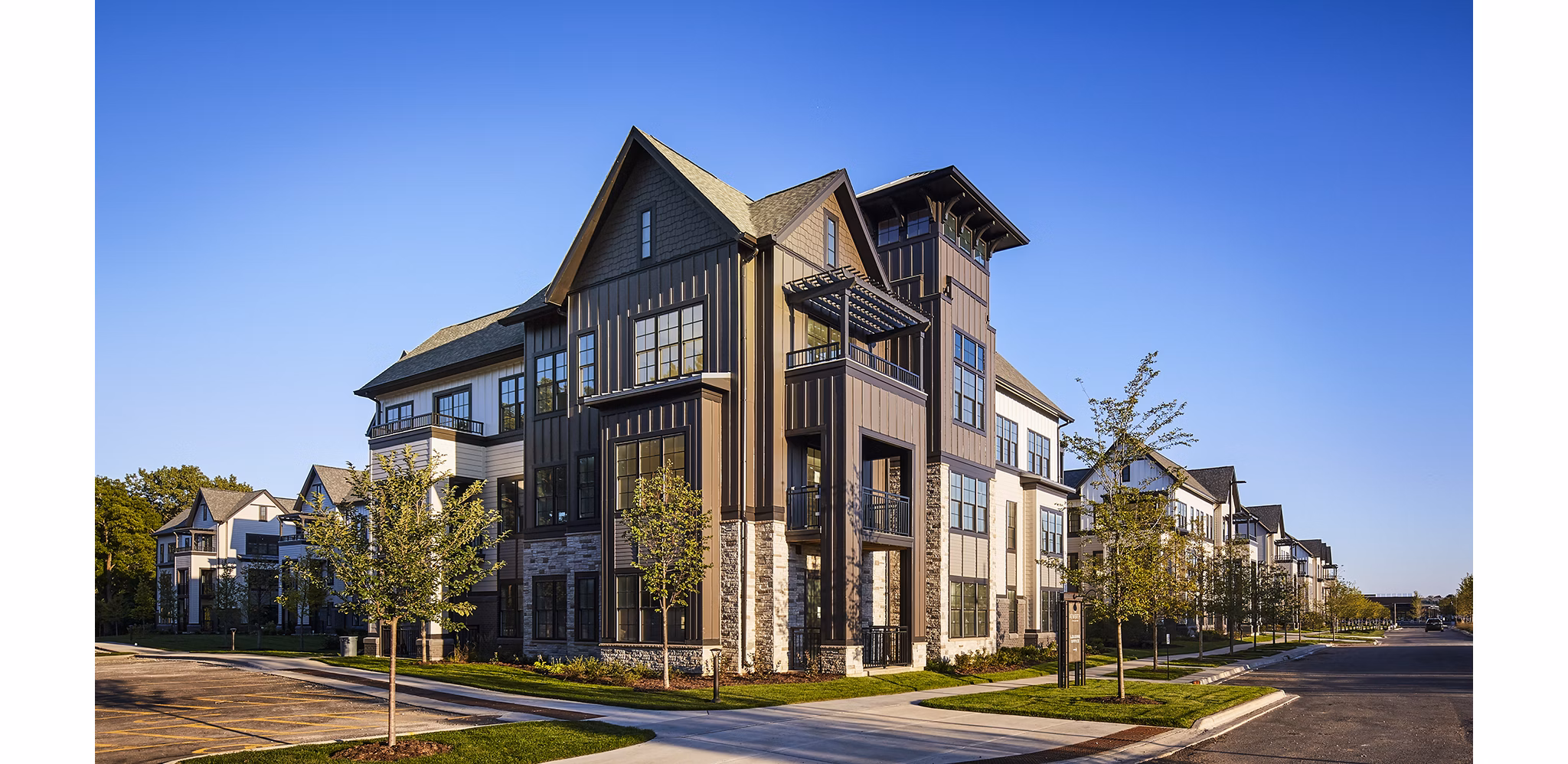 The Atworth at Mellody Farms: Luxury apartment exteriors with landscaped gardens in vibrant neighborhood