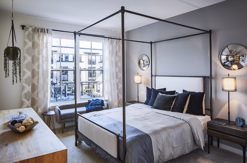 Cozy bedroom with modern decor at The Atworth at Mellody Farms Apartments
