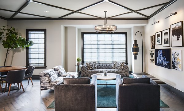 Modern clubhouse with cozy seating at The Atworth at Mellody Farms Apartments