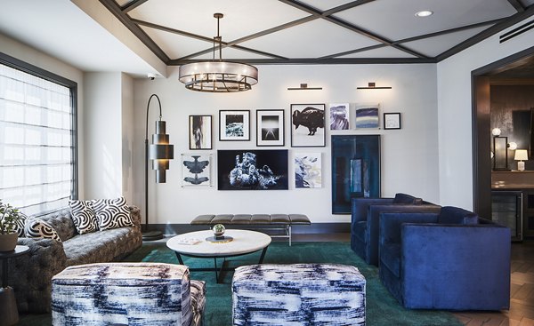 Clubhouse featuring modern design and comfortable seating at The Atworth at Mellody Farms Apartments