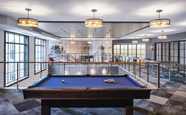 Clubhouse with modern furnishings at The Atworth at Mellody Farms Apartments featuring social and recreational spaces