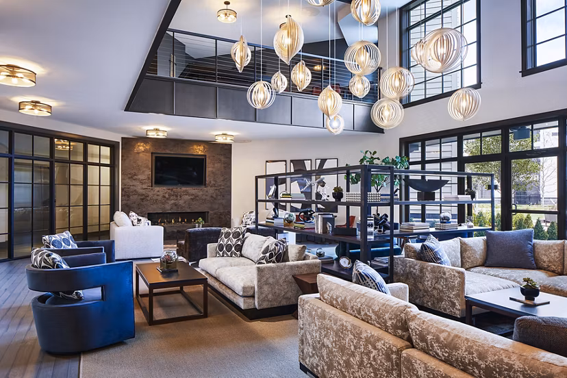 Clubhouse featuring modern decor and cozy seating at The Atworth at Mellody Farms Apartments