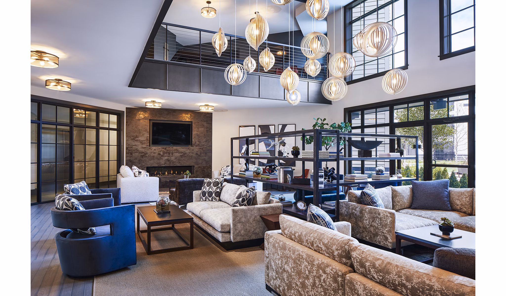 Clubhouse featuring modern decor and cozy seating at The Atworth at Mellody Farms Apartments