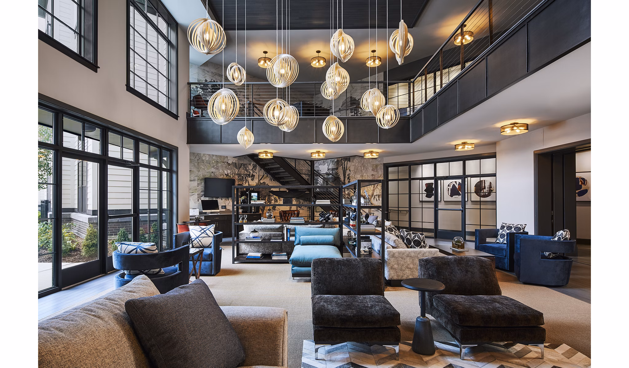 Clubhouse featuring modern decor and seating at The Atworth at Mellody Farms Apartments in Greystar's luxury community
