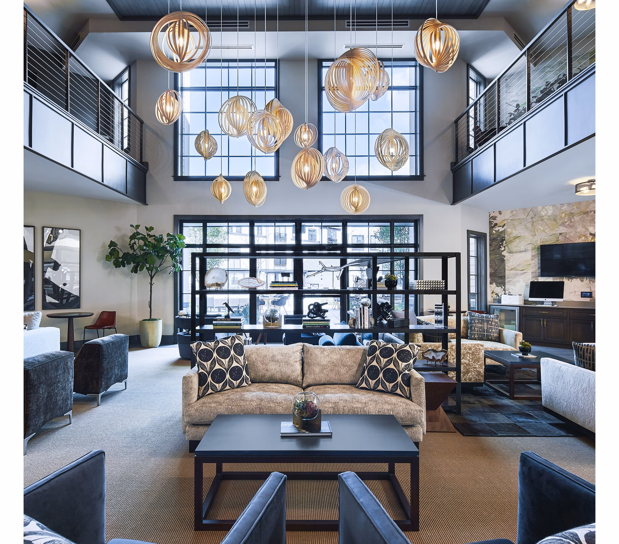 Clubhouse featuring modern design and cozy seating at The Atworth at Mellody Farms Apartments