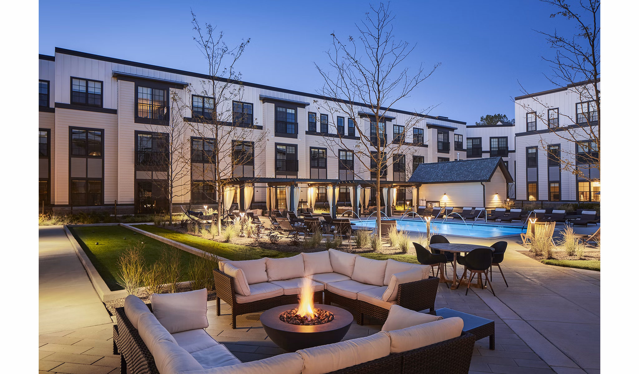 Cozy outdoor fire pit area at The Atworth at Mellody Farms Apartments, ideal for evening gatherings and relaxation