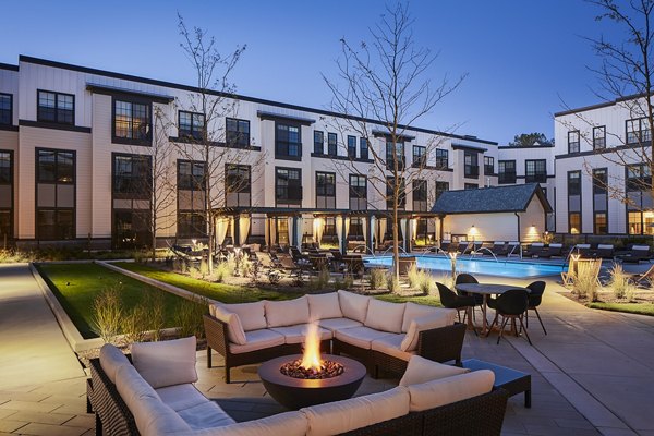 Cozy outdoor fire pit area at The Atworth at Mellody Farms Apartments, ideal for evening gatherings and relaxation