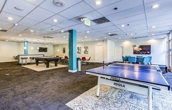 Clubhouse game room with billiards and modern seating at The Chadwick Apartments, a luxury living community by Greystar