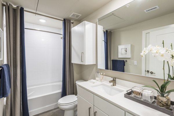 Modern bathroom with sleek fixtures at Eighteen25 Downtown Apartments, a Greystar luxury property in the heart of the city