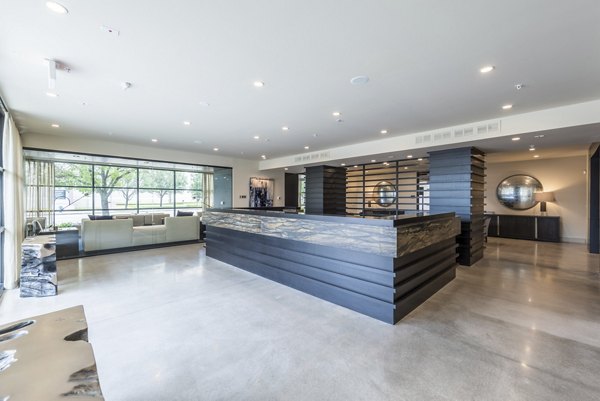 Clubhouse featuring modern design and comfortable seating at Eighteen25 Downtown Apartments
