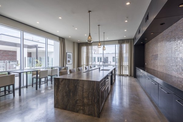 Clubhouse featuring modern design and ample seating at Eighteen25 Downtown Apartments