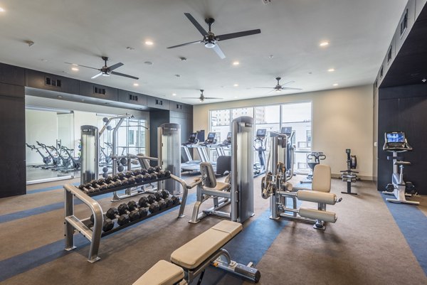 Fitness center with modern equipment at Eighteen25 Downtown Apartments in the Greystar community