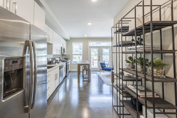 Kitchen with modern appliances and sleek cabinetry in Eighteen25 Downtown Apartments, a luxury community in the Greystar property portfolio