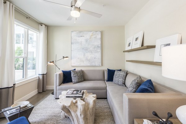 Spacious living room with modern decor in Eighteen25 Downtown Apartments