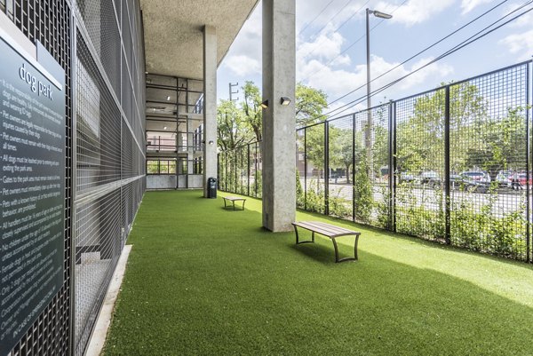 Leash-free dog park with agility equipment at Eighteen25 Downtown Apartments