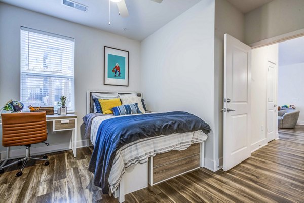 Spacious bedroom with modern furnishings at Union Blacksburg Apartments