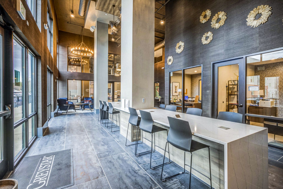 Clubhouse and leasing office at Union Blacksburg Apartments featuring modern design and comfortable seating in a welcoming environment
