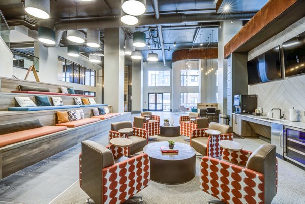 Clubhouse featuring modern design and spacious seating at Union Blacksburg Apartments
