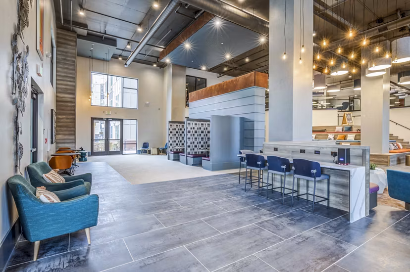 Union Blacksburg Apartments: Stylish clubhouse with modern seating and entertainment areas