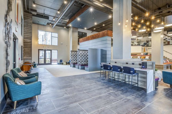 Union Blacksburg Apartments: Stylish clubhouse with modern seating and entertainment areas