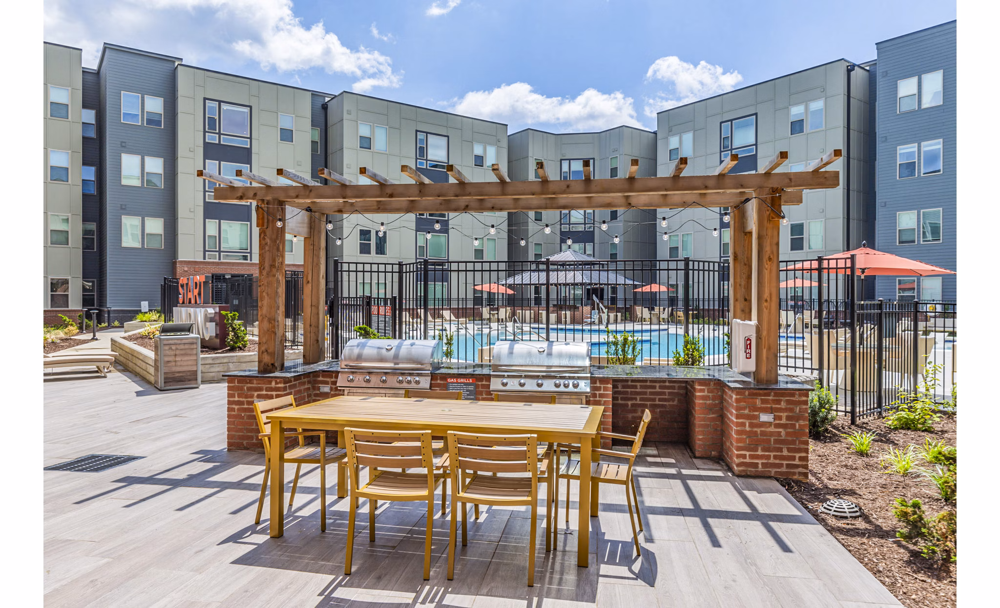 Outdoor grill area with cozy seating at Union Blacksburg Apartments, perfect for social gatherings and relaxing evenings