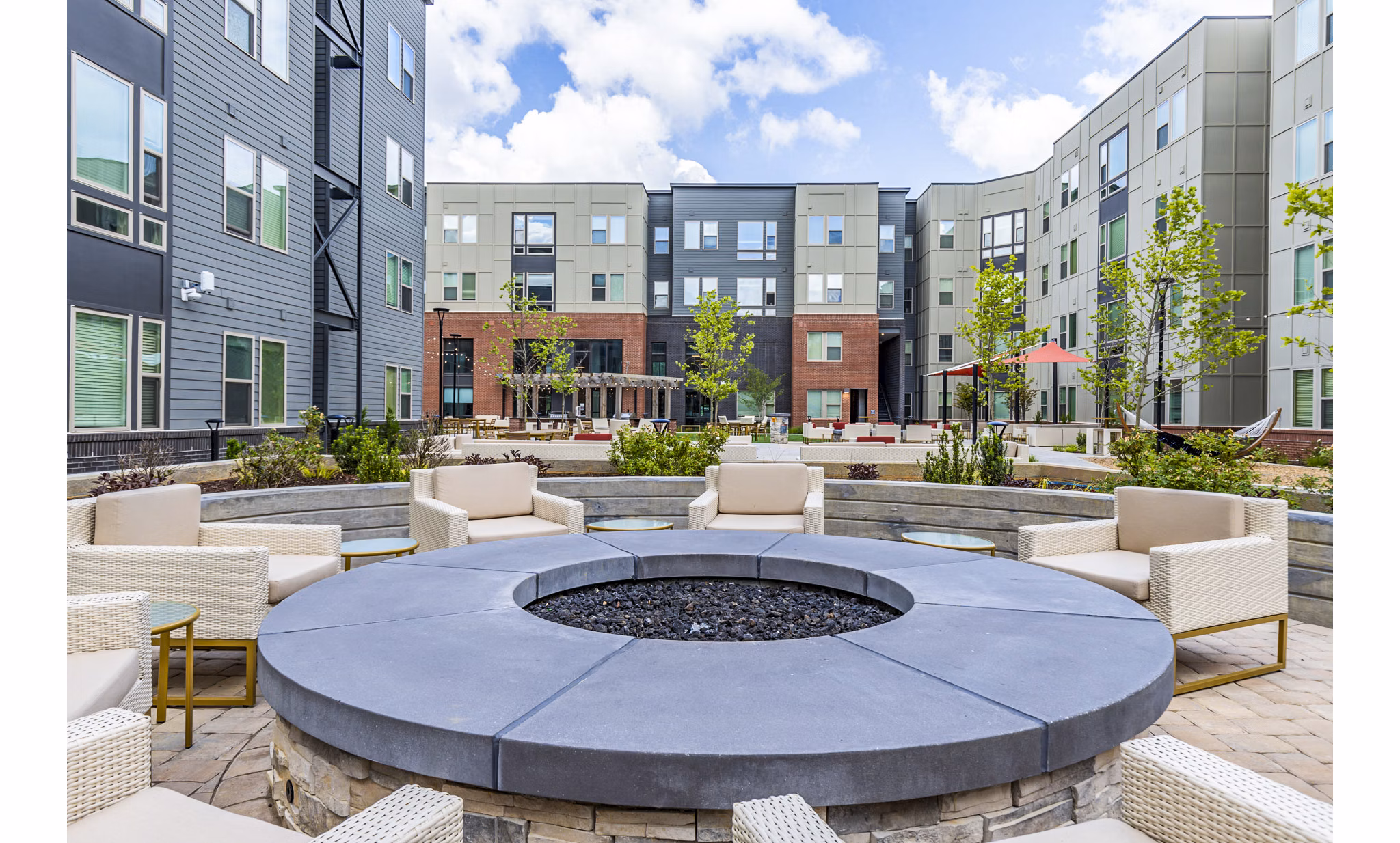 Outdoor fire pit seating area at Union Blacksburg Apartments, ideal for social gatherings and relaxation