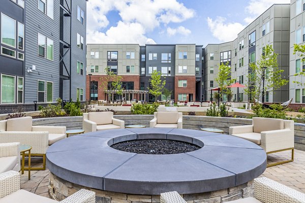 Outdoor fire pit seating area at Union Blacksburg Apartments, ideal for social gatherings and relaxation