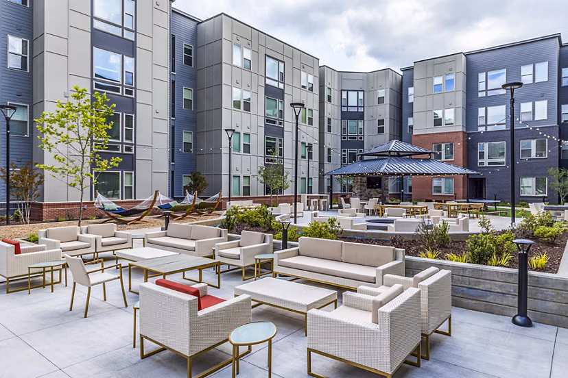 Courtyard featuring modern patio area with seating at Union Blacksburg Apartments