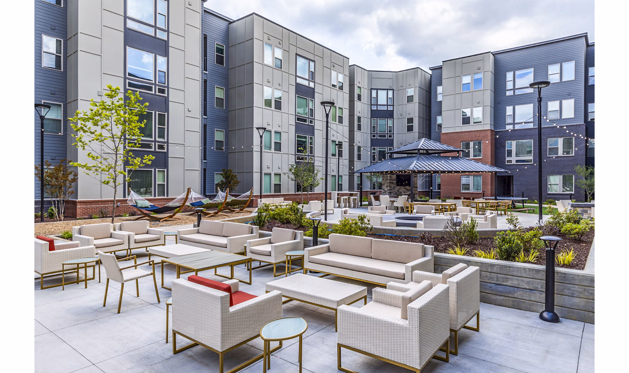 Courtyard featuring modern patio area with seating at Union Blacksburg Apartments