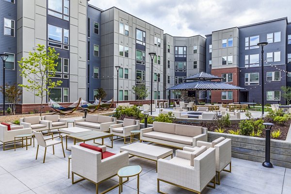 Courtyard featuring modern patio area with seating at Union Blacksburg Apartments