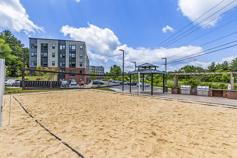 Volleyball court at Union Blacksburg Apartments offering modern sporting amenities for residents
