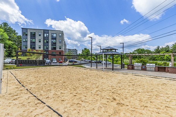Volleyball court at Union Blacksburg Apartments offering modern sporting amenities for residents