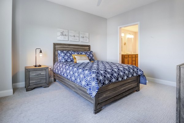 Modern bedroom with stylish decor at Overlook at River Place Apartments