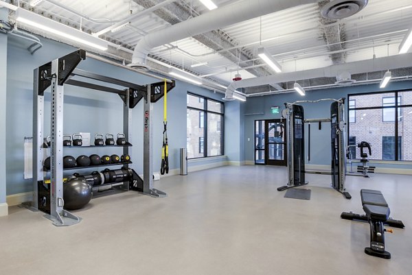 Fully-equipped fitness center with modern machines at Overlook at River Place Apartments