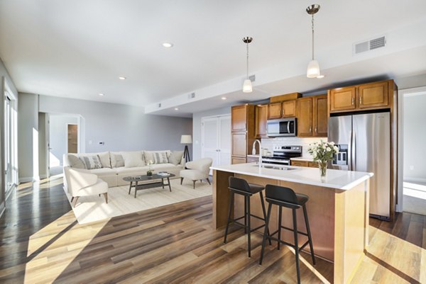Modern kitchen with sleek stainless steel appliances at Overlook at River Place Apartments