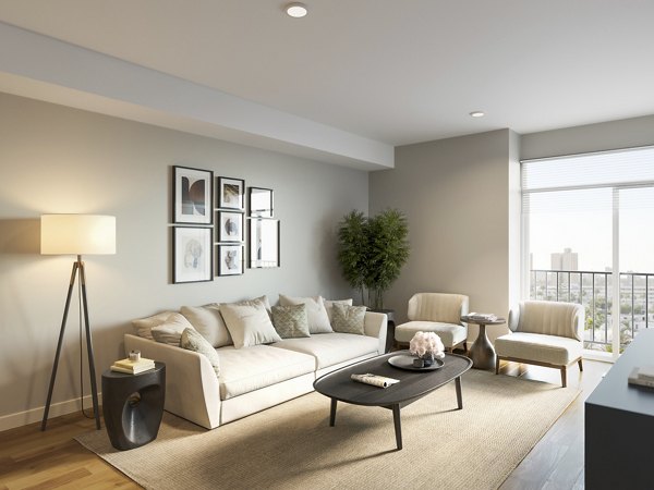 Spacious modern living room with plush furnishings at Overlook at River Place Apartments
