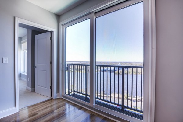 Spacious patio with stylish outdoor seating at Overlook at River Place Apartments, perfect for relaxing in a Greystar luxury setting