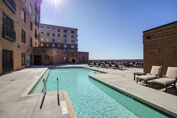 Sparkling pool with sun loungers at Overlook at River Place Apartments, a luxury Greystar community