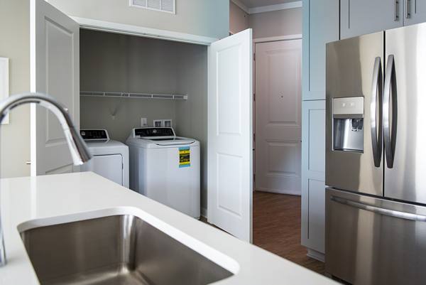 laundry room at One Riverside Apartments