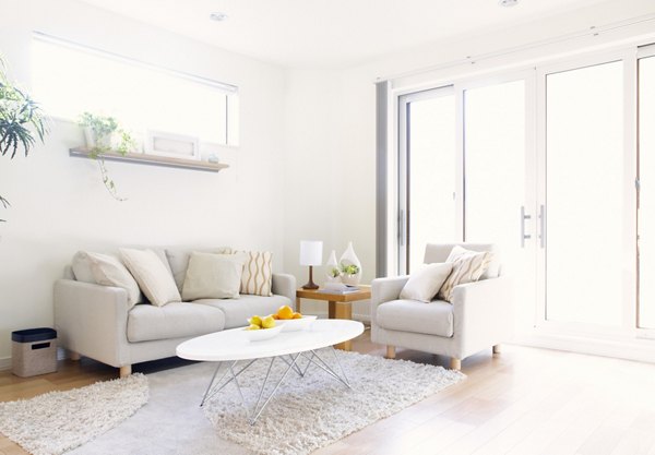 Open-concept living room with modern decor and natural light at 22Hundred Apartments