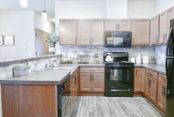 Modern kitchen with stainless steel appliances in Diamond Rock Rentals